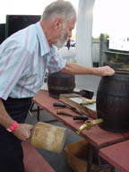 Ernst Frankenberg, tapping old beer barrels at a Museum of Beer and Brewing Fundraiser; photo by Lucy Saunders